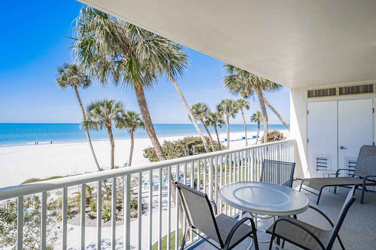 Step onto your private balcony and take in stunning views of sugar-white sand, swaying palms, and turquoise waters—your perfect beach escape awaits just steps away.