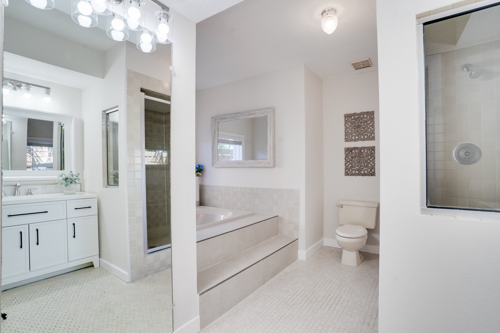 Your private spa-like bathroom features a luxurious soaking tub, spacious shower, and elegant finishes for ultimate relaxation.