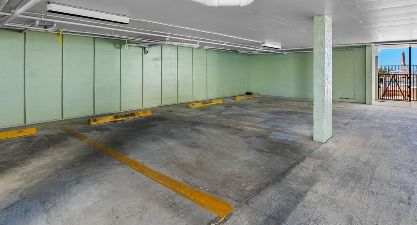 Covered parking garage with clearly marked spaces ensures your vehicle stays protected from the sun throughout your stay.