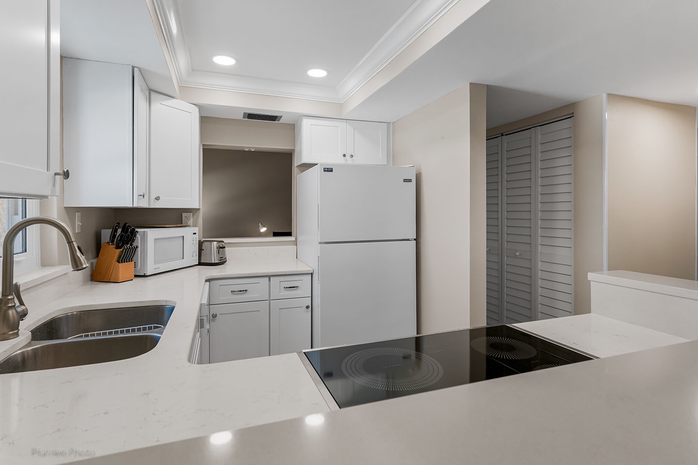 Kitchen has pass through to front den area