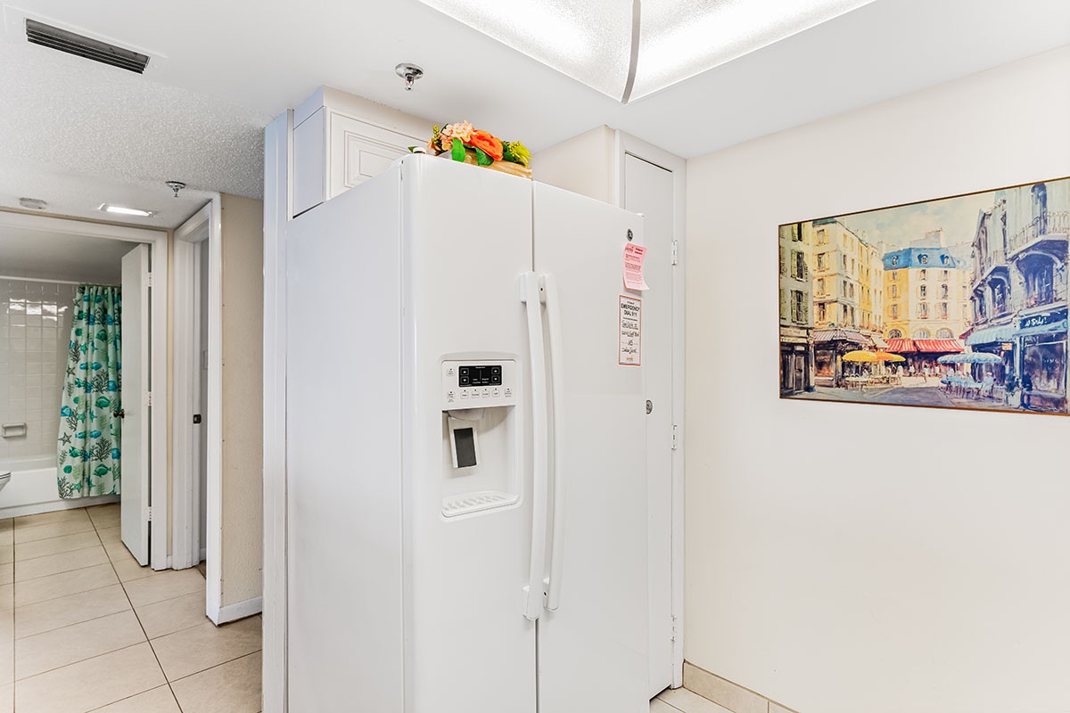 Your spacious kitchen features a full-size refrigerator with ice and water dispenser, perfect for storing groceries during your stay.
