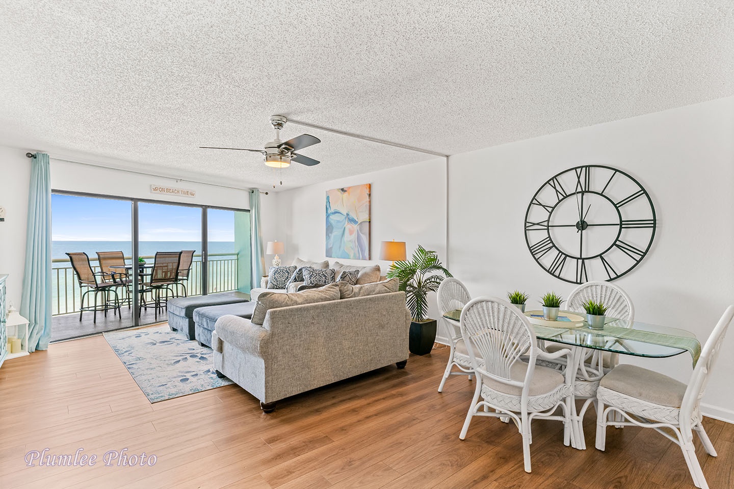 Open floor plan with solid floors and ceiling fan