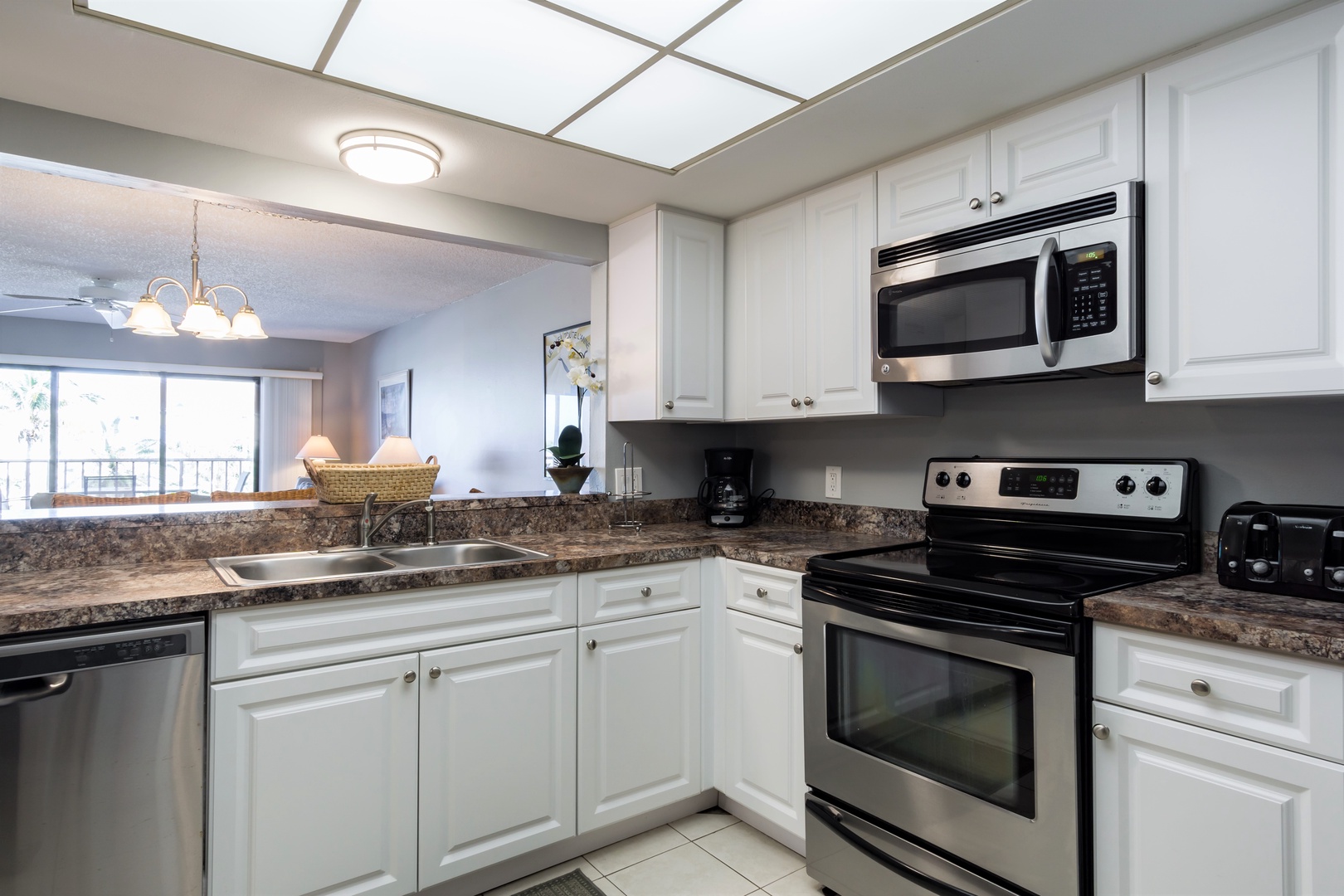 A fully equipped kitchen with pass through to dining area.