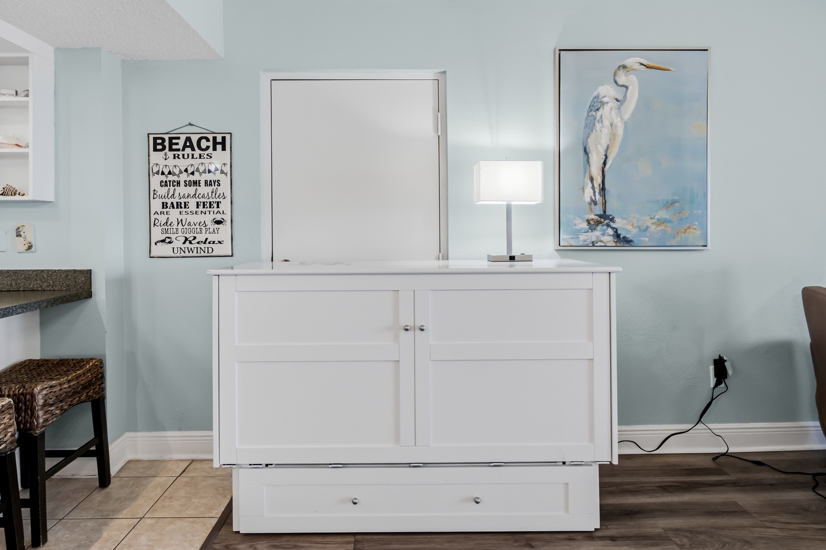 Coastal charm meets clever comfort in this serene space. Your retreat features a Queen Murphy bed for flexible living, beachy decor, and a soothing palette that sets the perfect vacation mood.