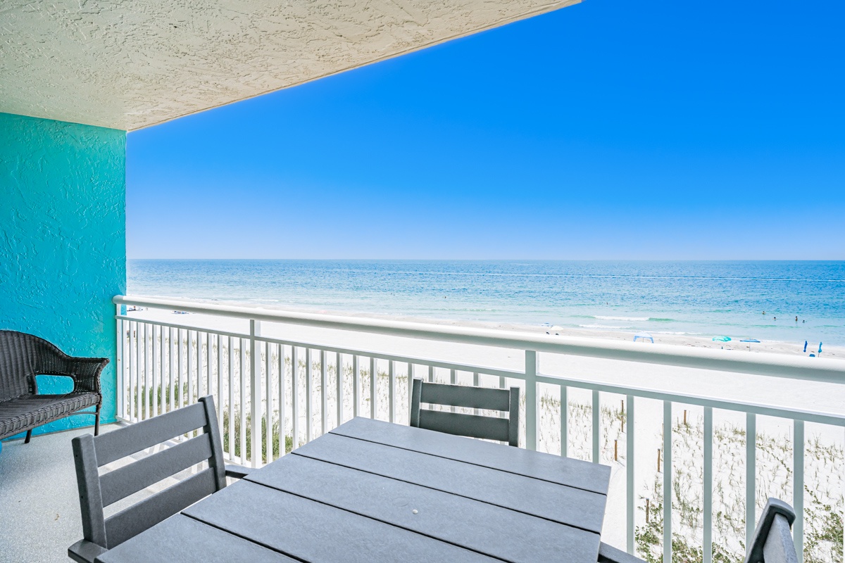 Step onto your private balcony and take in the stunning beachfront views, where soft white sand meets crystal-clear waters stretching to the horizon.