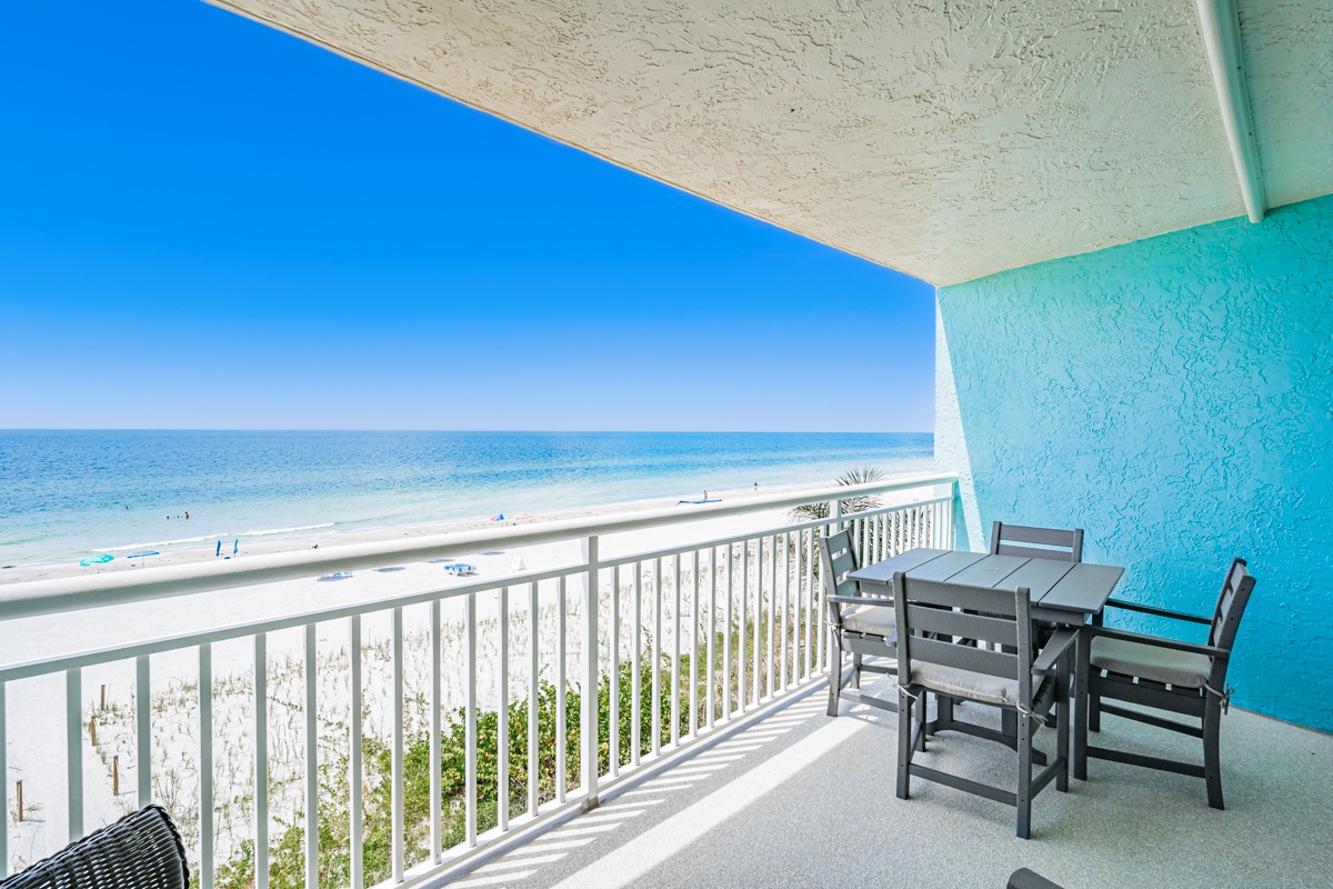 Your private balcony opens to sweeping views of soft white sand and turquoise waters—perfect for morning coffee or sunset cocktails with the gentle sound of waves below.
