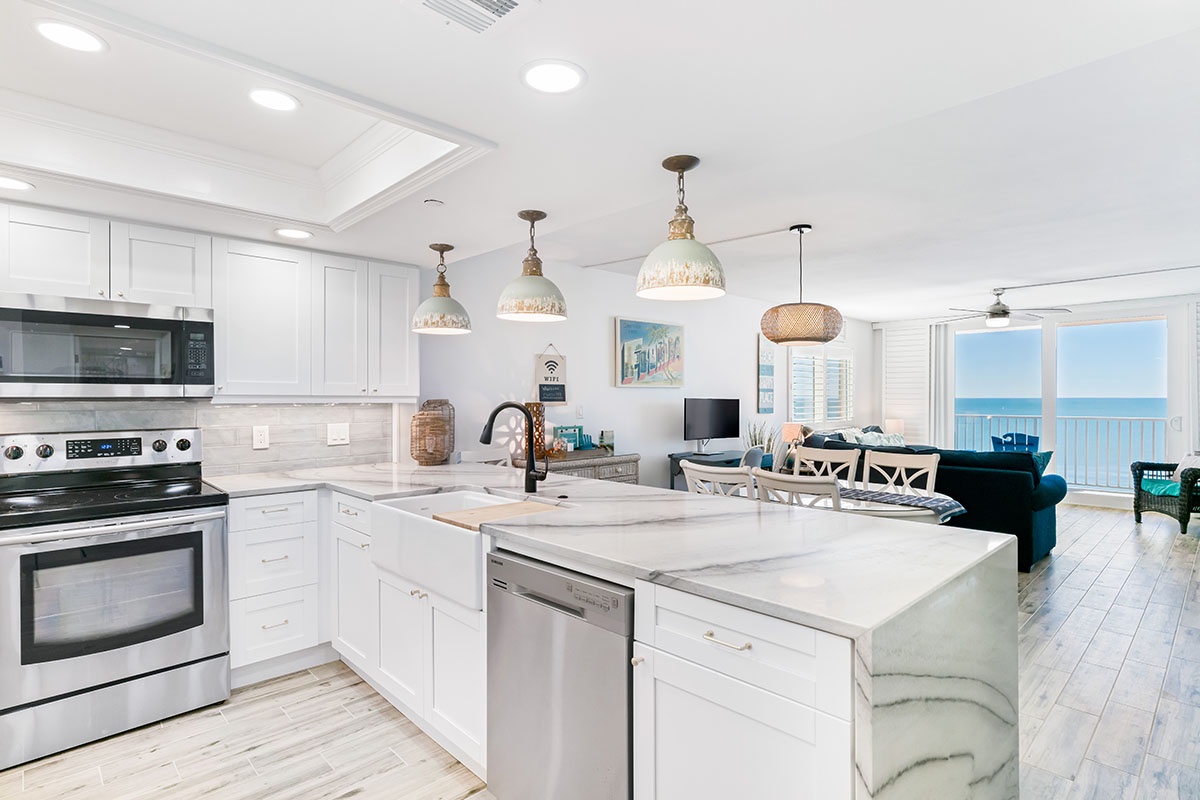 Your stunning white kitchen flows into the dining and living areas, with ocean views creating the perfect backdrop for cooking and relaxing.