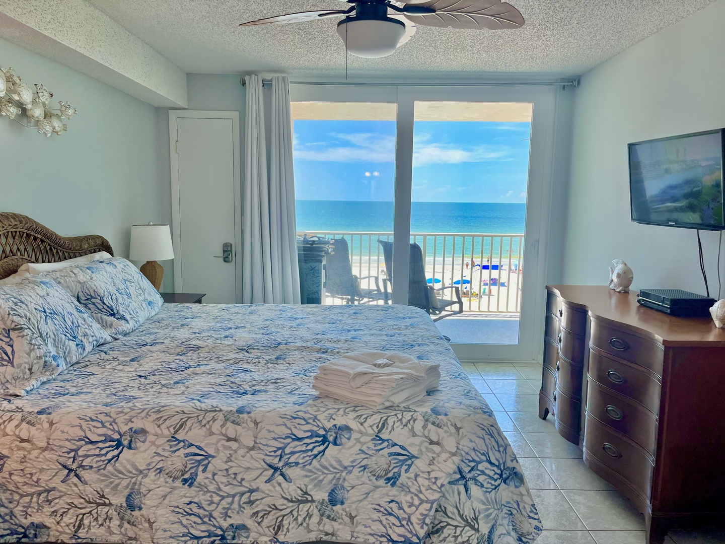 Primary bedroom with TV and Gulf view