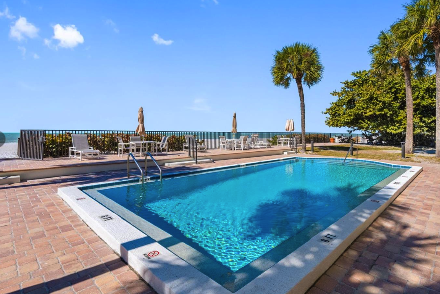 Steps away from the sparkling waters, this beachfront pool offers an inviting oasis framed by swaying palms and coastal breezes.