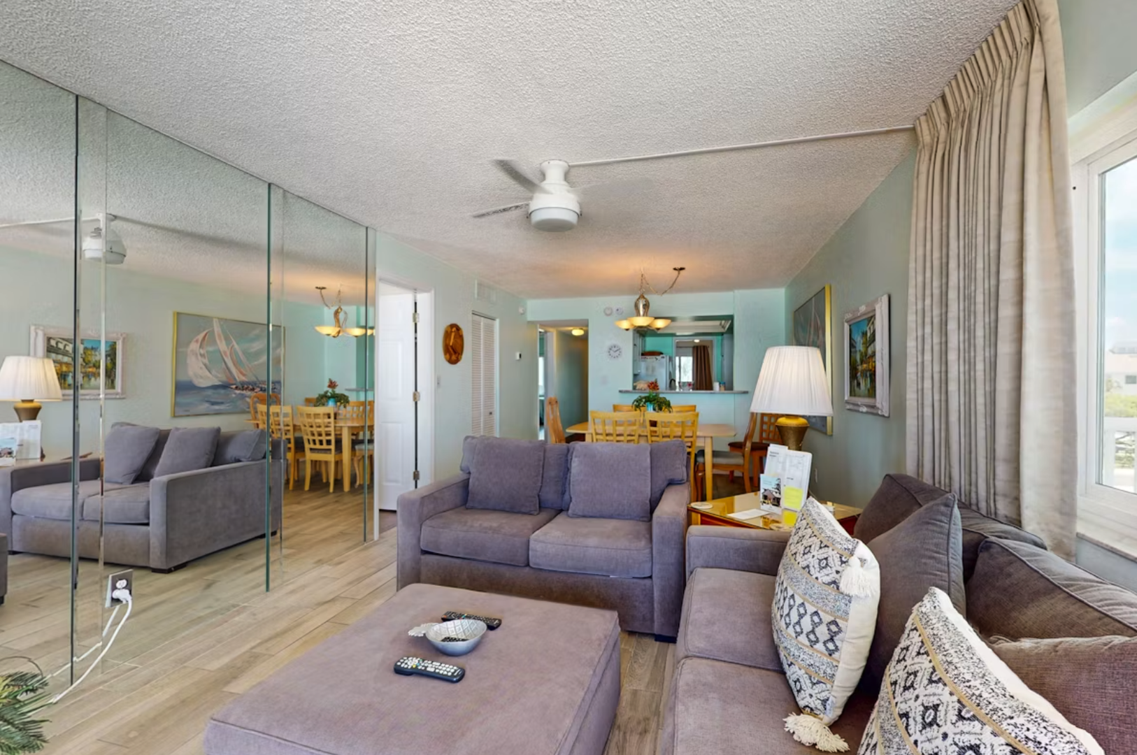 Unwind in your spacious living area, where soft coastal colors and ample seating create the perfect spot to relax after a day of adventure. Large windows invite natural light and ocean breezes.