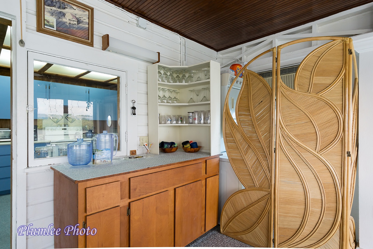 2nd Floor.  Dining Area with tropical screen and sideboard.