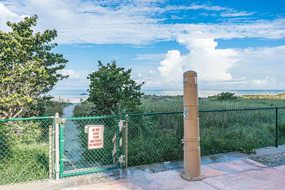 Beachfront location with direct access to pristine sandy shores and crystal-clear waters.