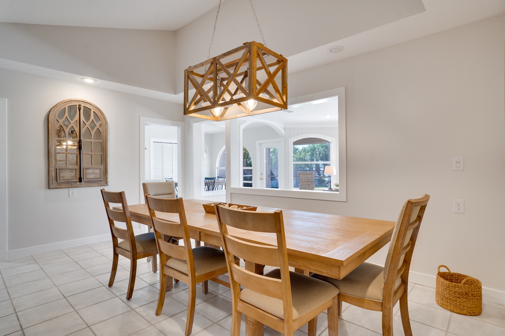 Gather around your elegant dining table under stunning statement lighting for memorable meals together.