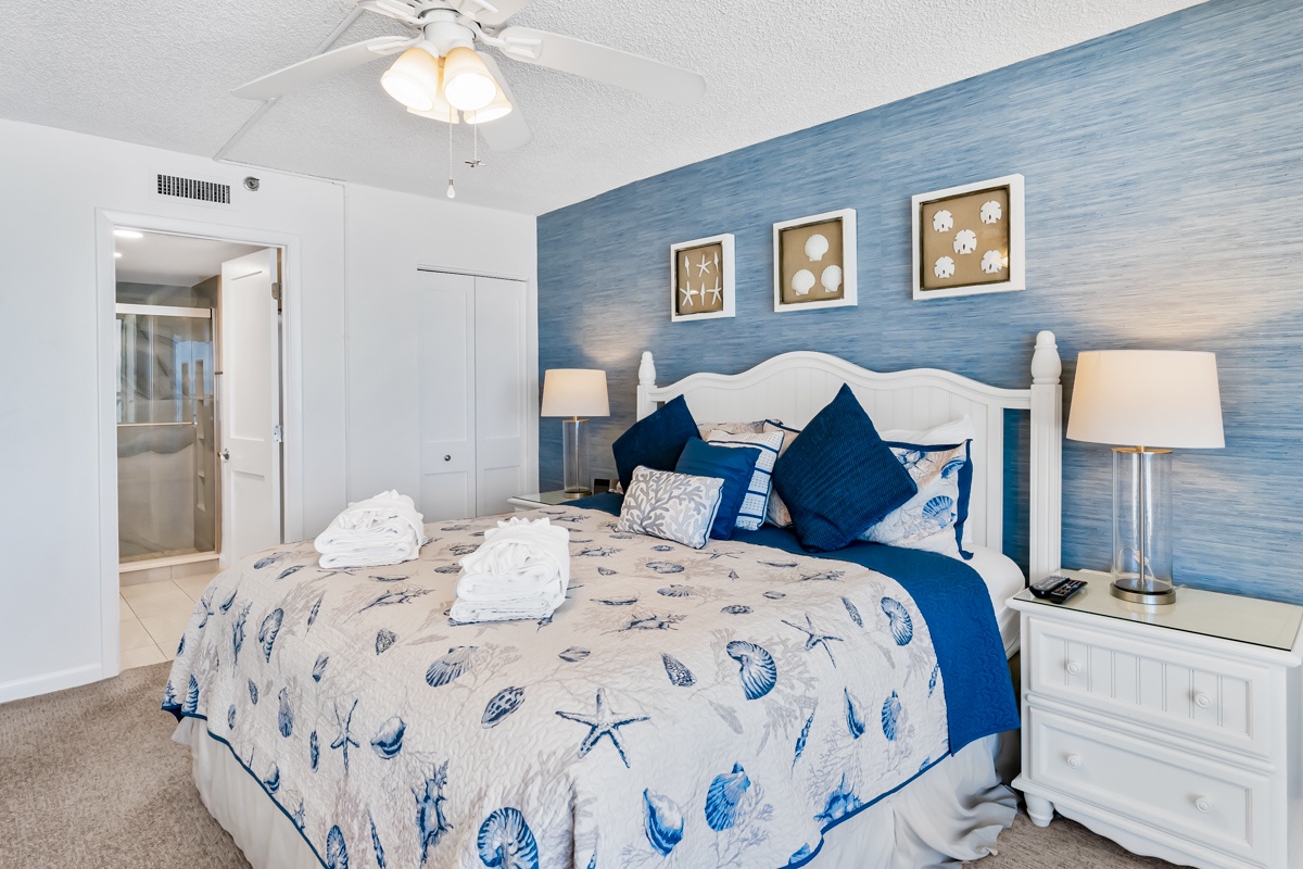 Drift off in this coastal-inspired bedroom, where soft ocean hues and beach-themed bedding create your tranquil retreat. Ceiling fan keeps you comfortable year-round.