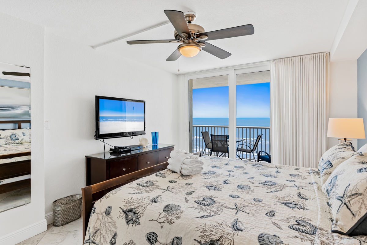 Wake up to stunning ocean views through your private balcony doors. This peaceful master bedroom features comfortable bedding and modern amenities for ultimate relaxation.