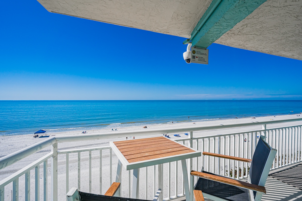 Your private beachfront balcony offers stunning ocean views where you can sip morning coffee while watching waves gently meet pristine white sand.