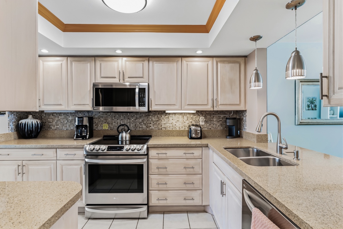Step into this bright, well-equipped kitchen where you'll find everything needed to whip up your favorite meals. Modern appliances and ample counter space make cooking a pleasure during your stay.