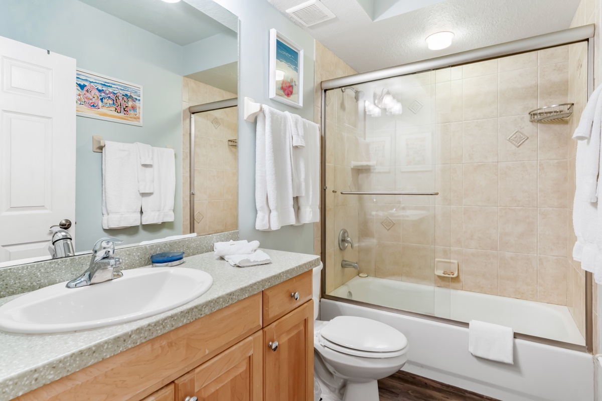 Refresh in your private bathroom with modern amenities, granite counters, and a spacious tub-shower combo.