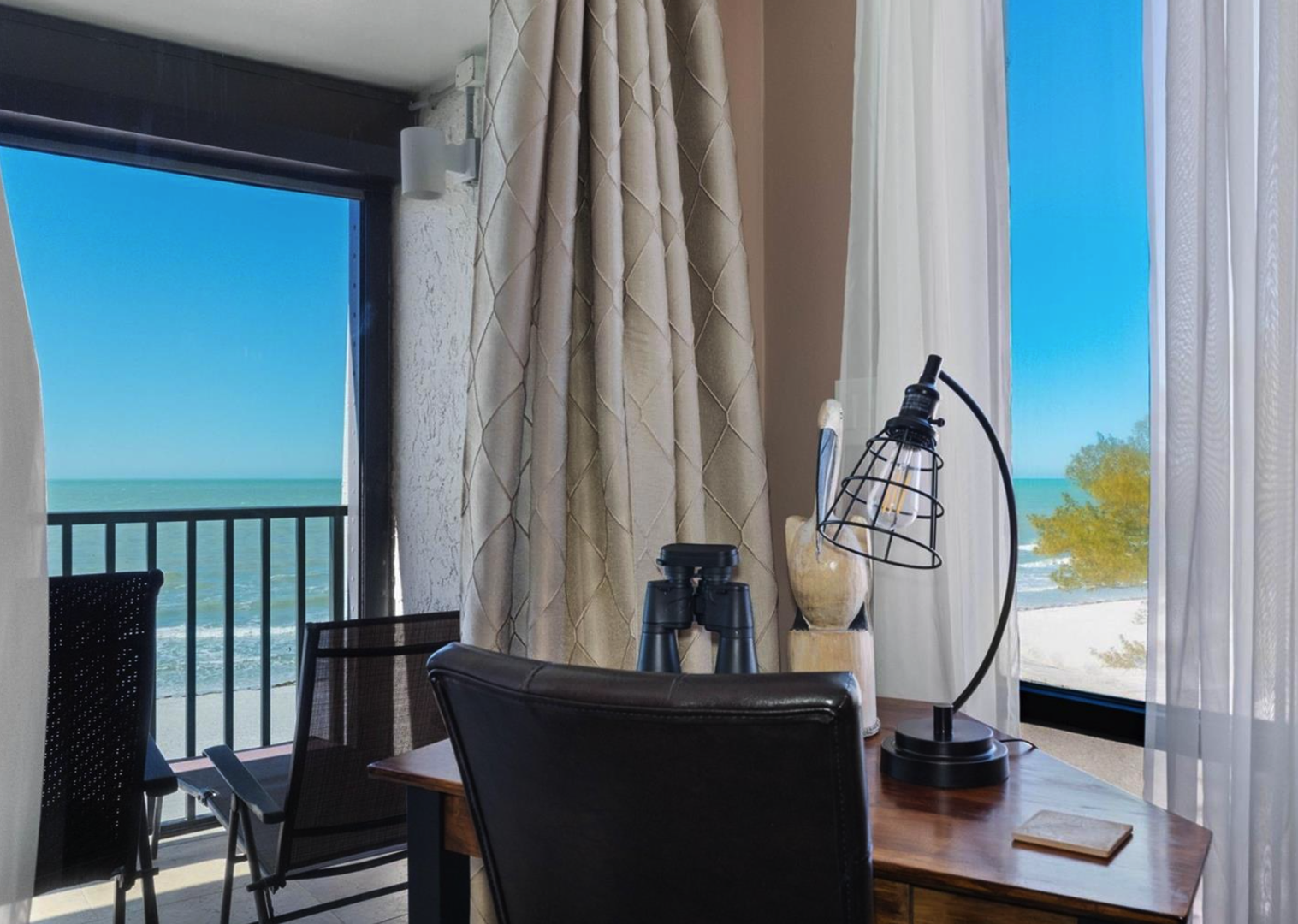 Relax in your inviting living space with stunning ocean views. Open the curtains to let in natural light and step onto your private balcony for fresh sea air.