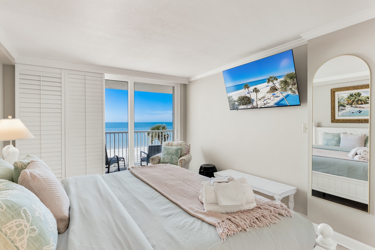 Wake up to stunning ocean views from your master bedroom's private balcony, where soft coastal colors create perfect serenity.