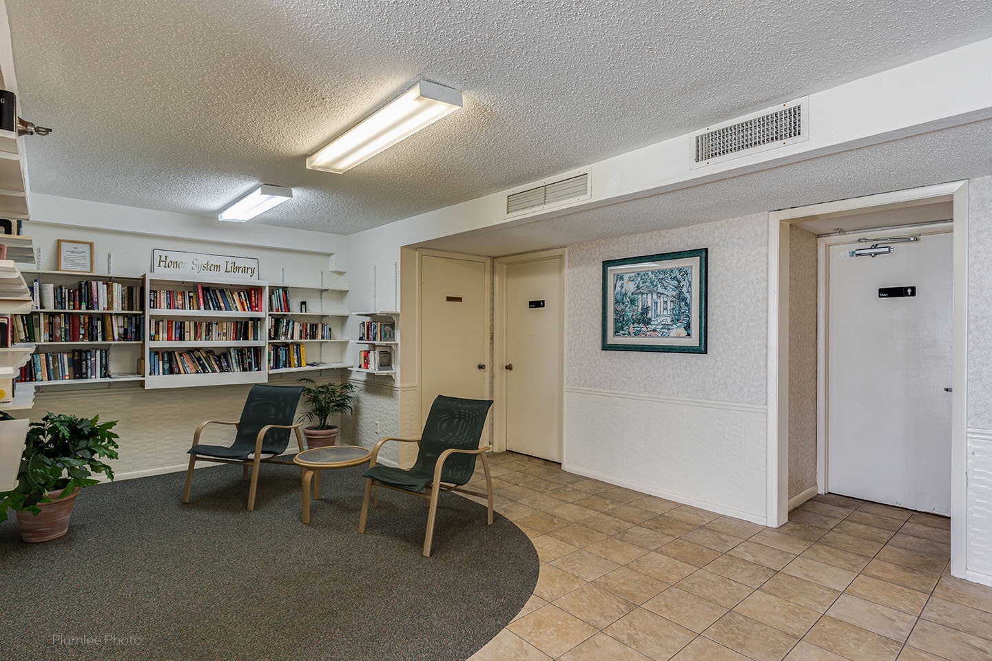 Community room with bathrooms next to pool area