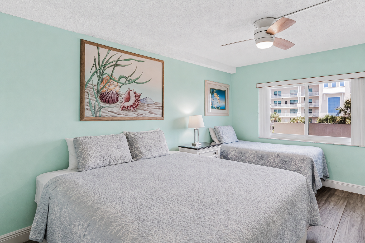 Relax in your coastal-inspired bedroom, where soothing mint walls and crisp white linens (king and twin) create a peaceful retreat after a day of adventure.