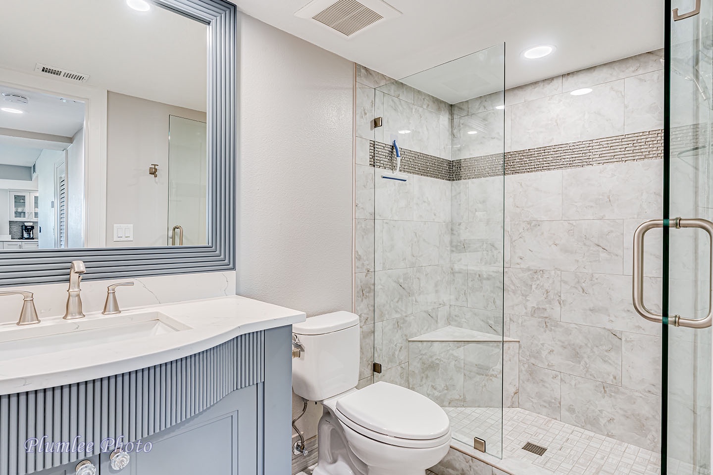 Hall bathroom with step in shower.