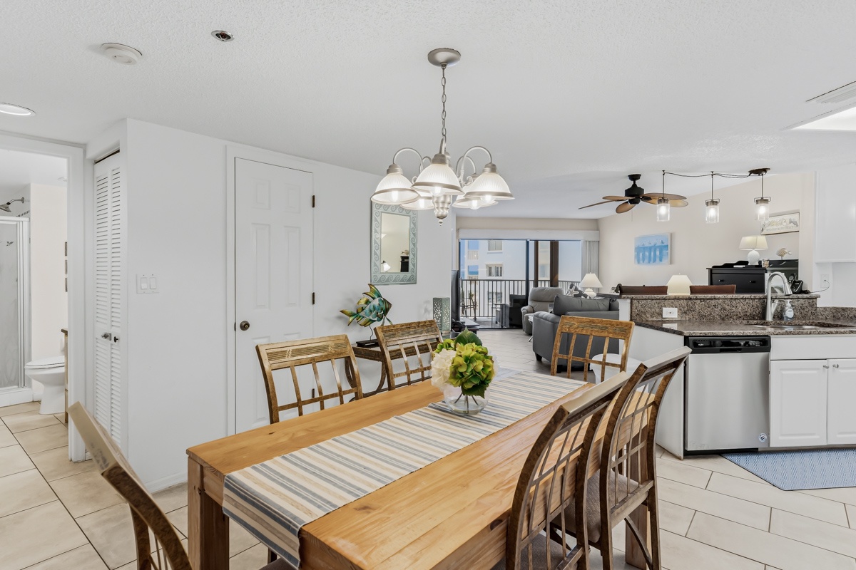 Gather around this inviting dining table and kitchen, where you can share meals and stories in comfort. The open layout flows seamlessly into your living space, making it easy to relax and connect with loved ones.