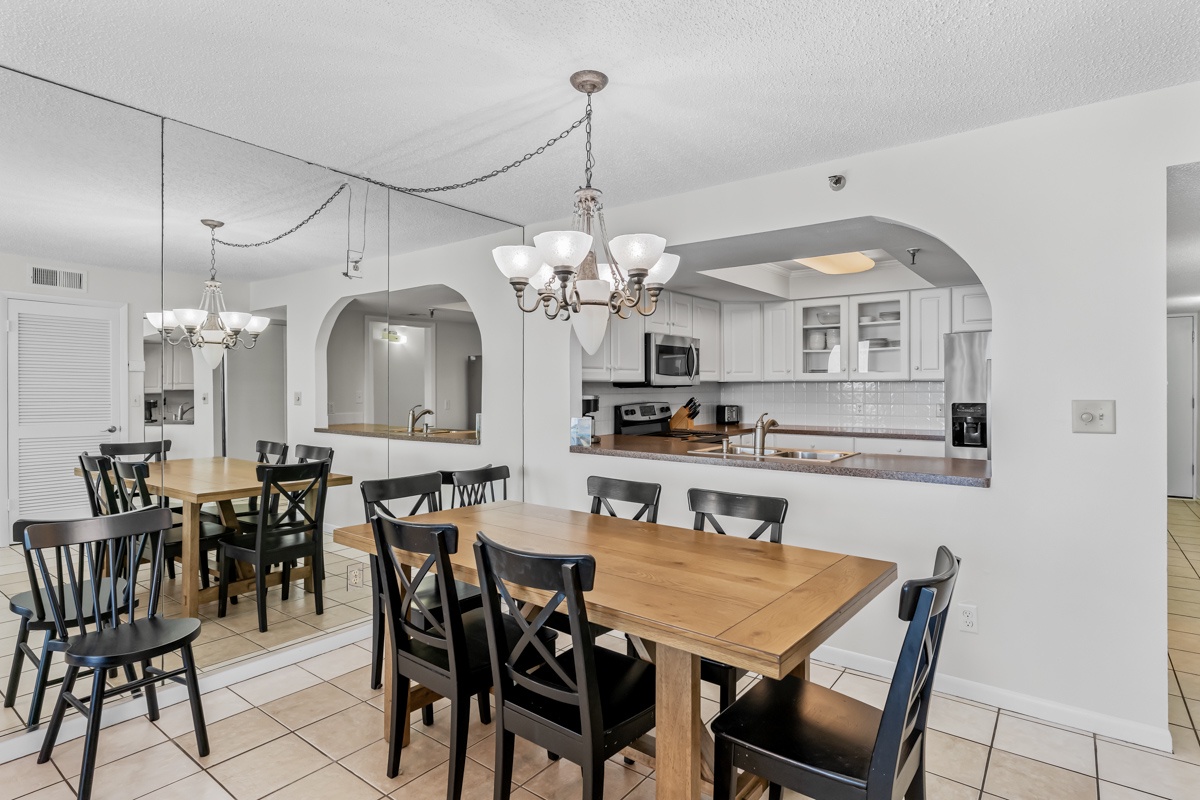 Your spacious dining area flows seamlessly into the fully-equipped kitchen, perfect for gathering around warm meals with family and friends.
