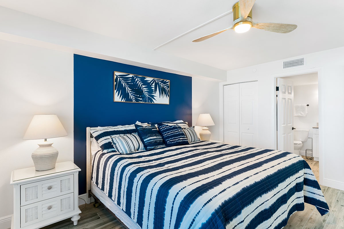 Drift off peacefully in your coastal-inspired bedroom with soft blue hues and crisp white linens.