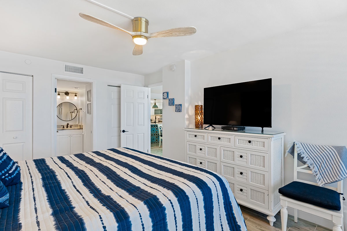 Wake up in your coastal bedroom with ocean-inspired blues, premium linens, and modern comforts like TV and ceiling fan.