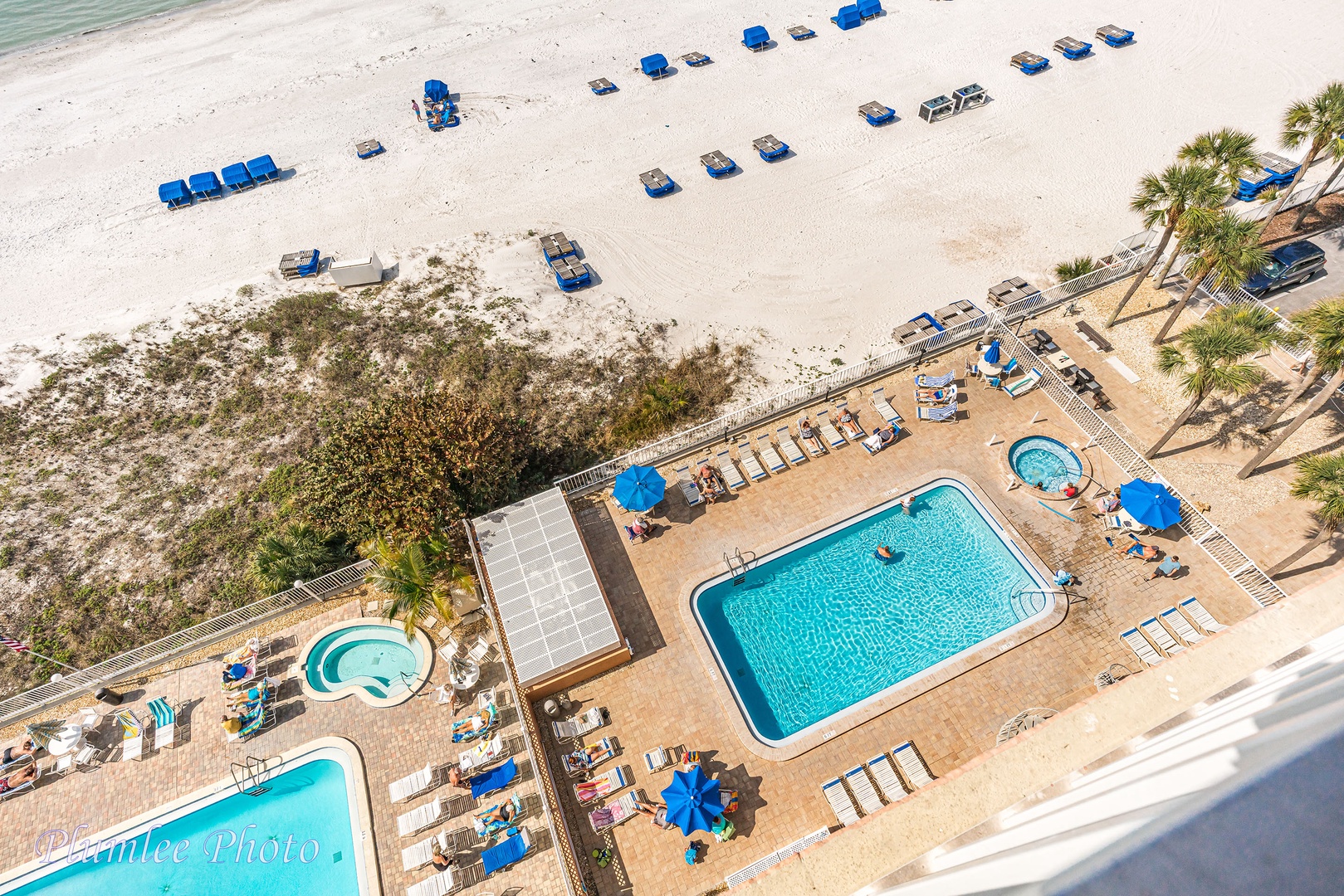 View from balcony of the pool and lounging area