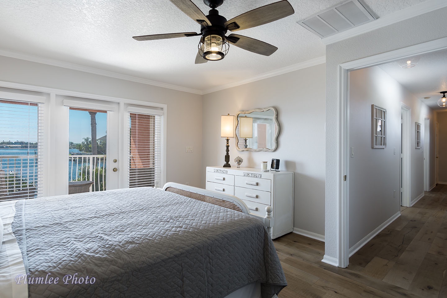 The master bedroom has an overhead fan.