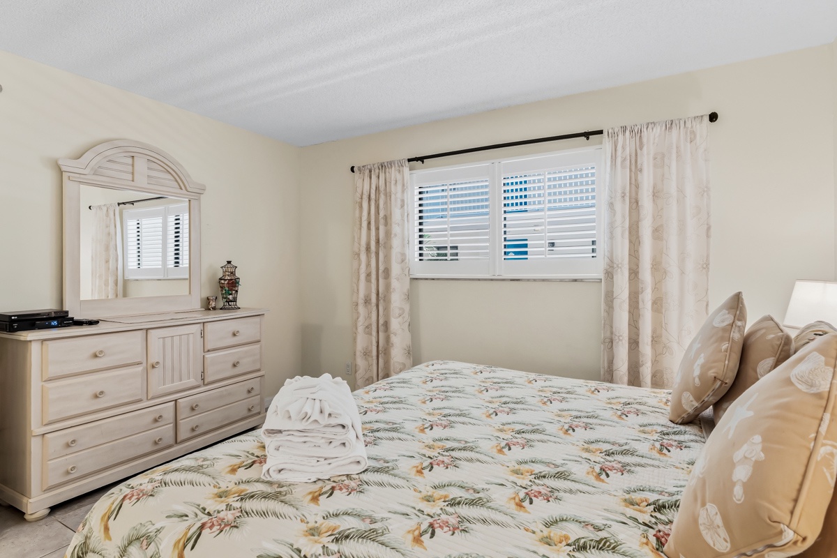 Drift off in your cozy guest room with soft linens, gentle natural light, and coastal-inspired decor that welcomes you home after a day of exploring.