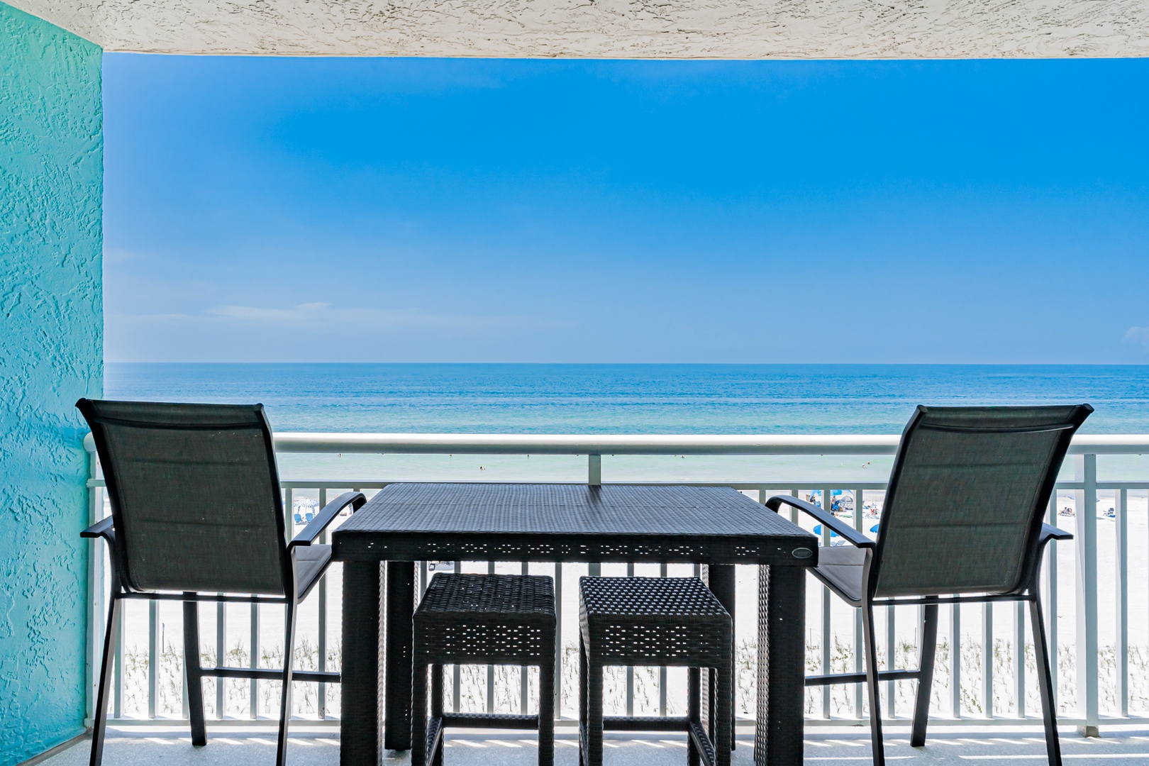 Your own private balcony awaits with a table for two and direct ocean views—watch the waves from your seat and breathe in the sea breeze.