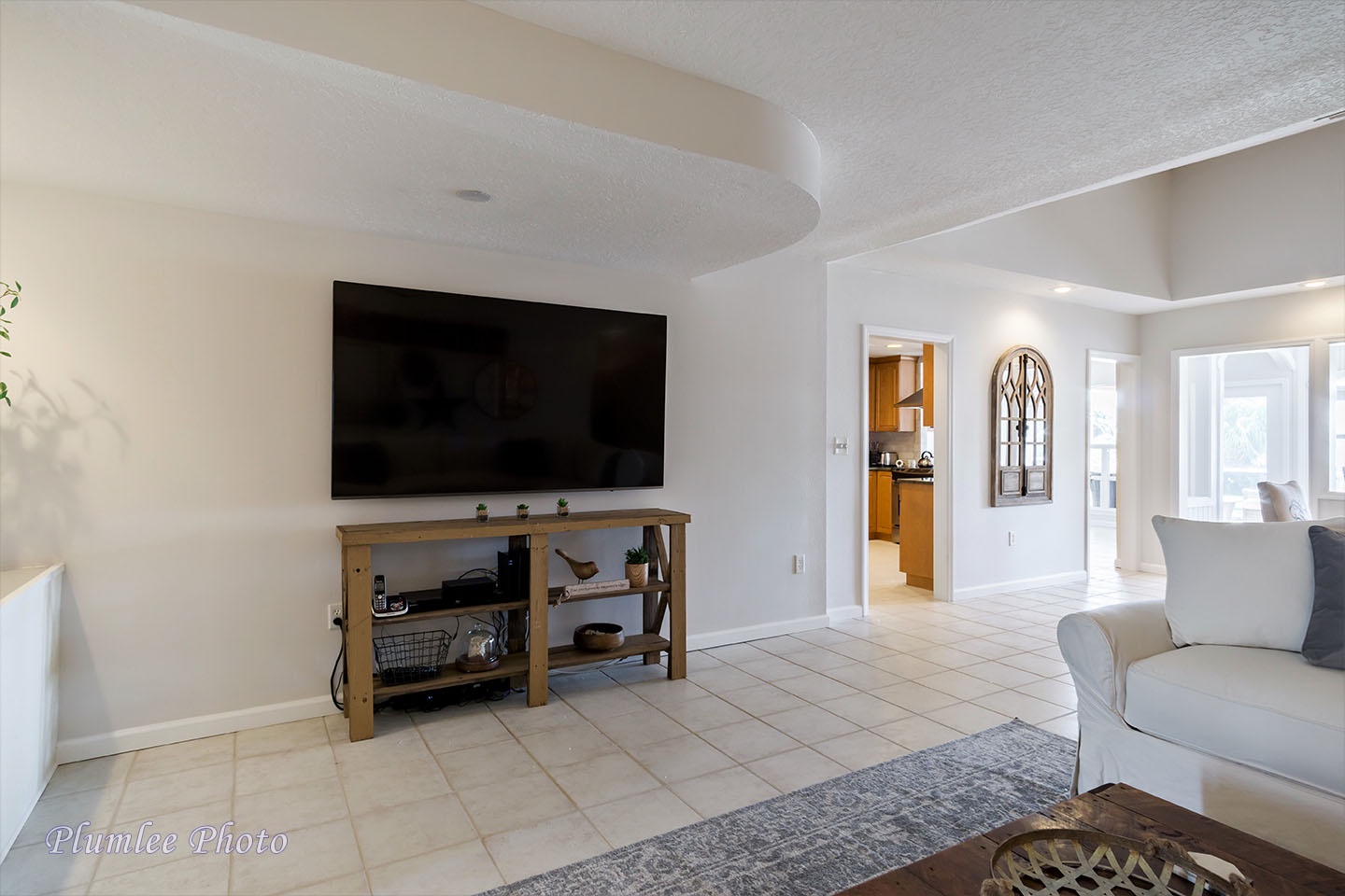 A big TV in the Family room and lots of seating make a nice home theatre.