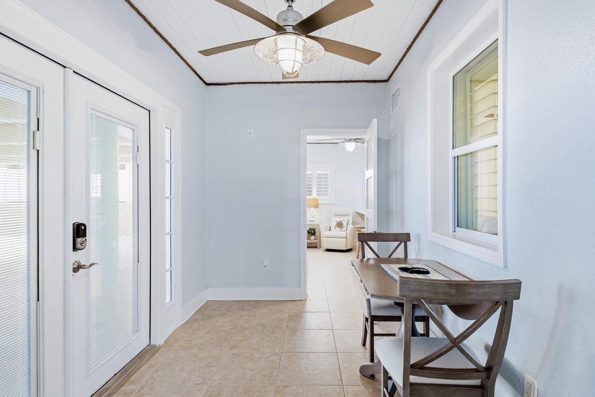 Your bright entryway welcomes you with coastal elegance and practical style for organizing your beach day adventures.