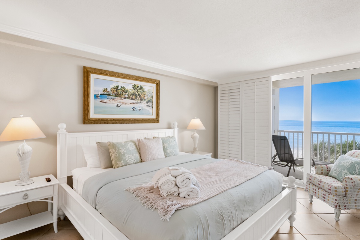 Wake up to stunning ocean views from your private balcony, where soft linens and coastal decor create your perfect seaside sanctuary.