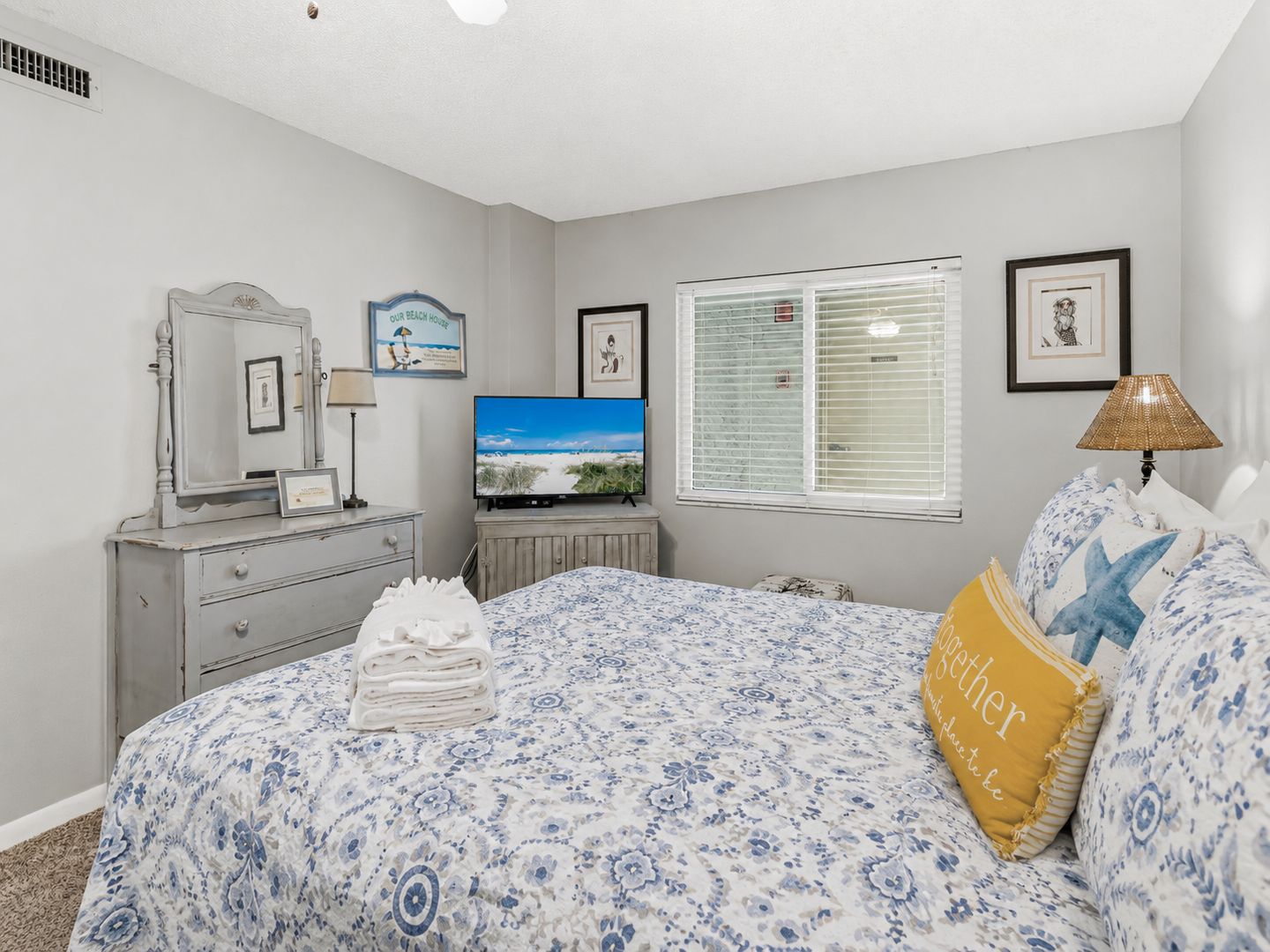 2nd bedroom with Queen bed, TV, and ceiling fan