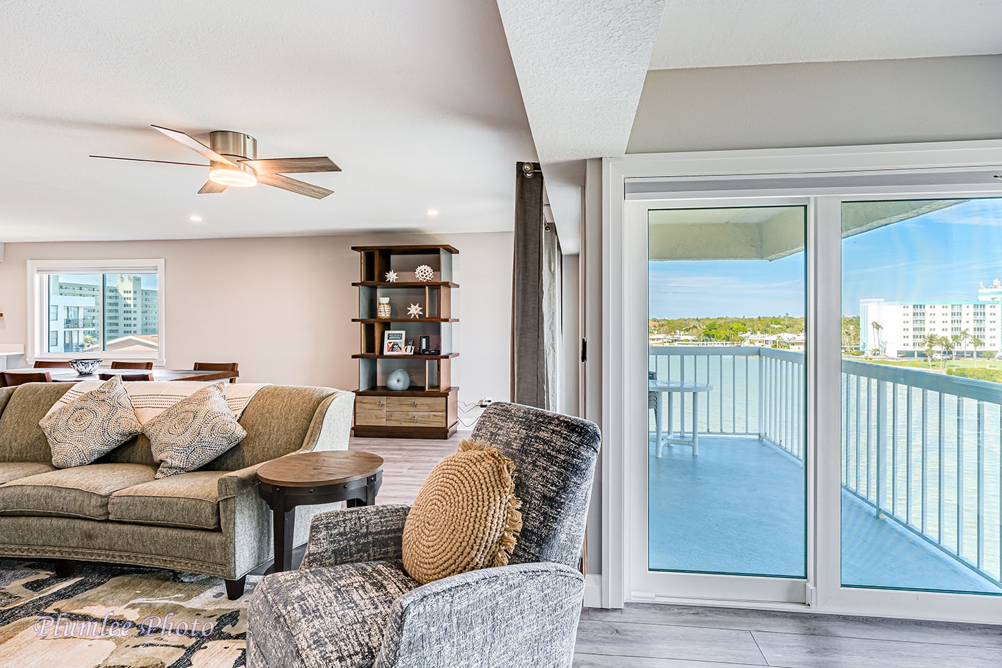 Living room has a nook with slider to balcony.