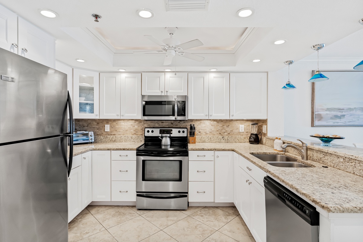 Your fully equipped kitchen features granite countertops, stainless steel appliances, and everything you need to prepare memorable meals during your stay.