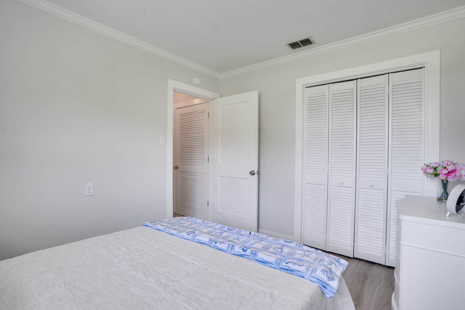 Your bright bedroom features a comfortable bed and generous closet space for all your belongings during your stay.