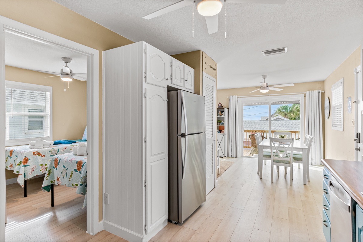 Step into your bright, airy kitchen where modern appliances and coastal views create the perfect space for your vacation meals.