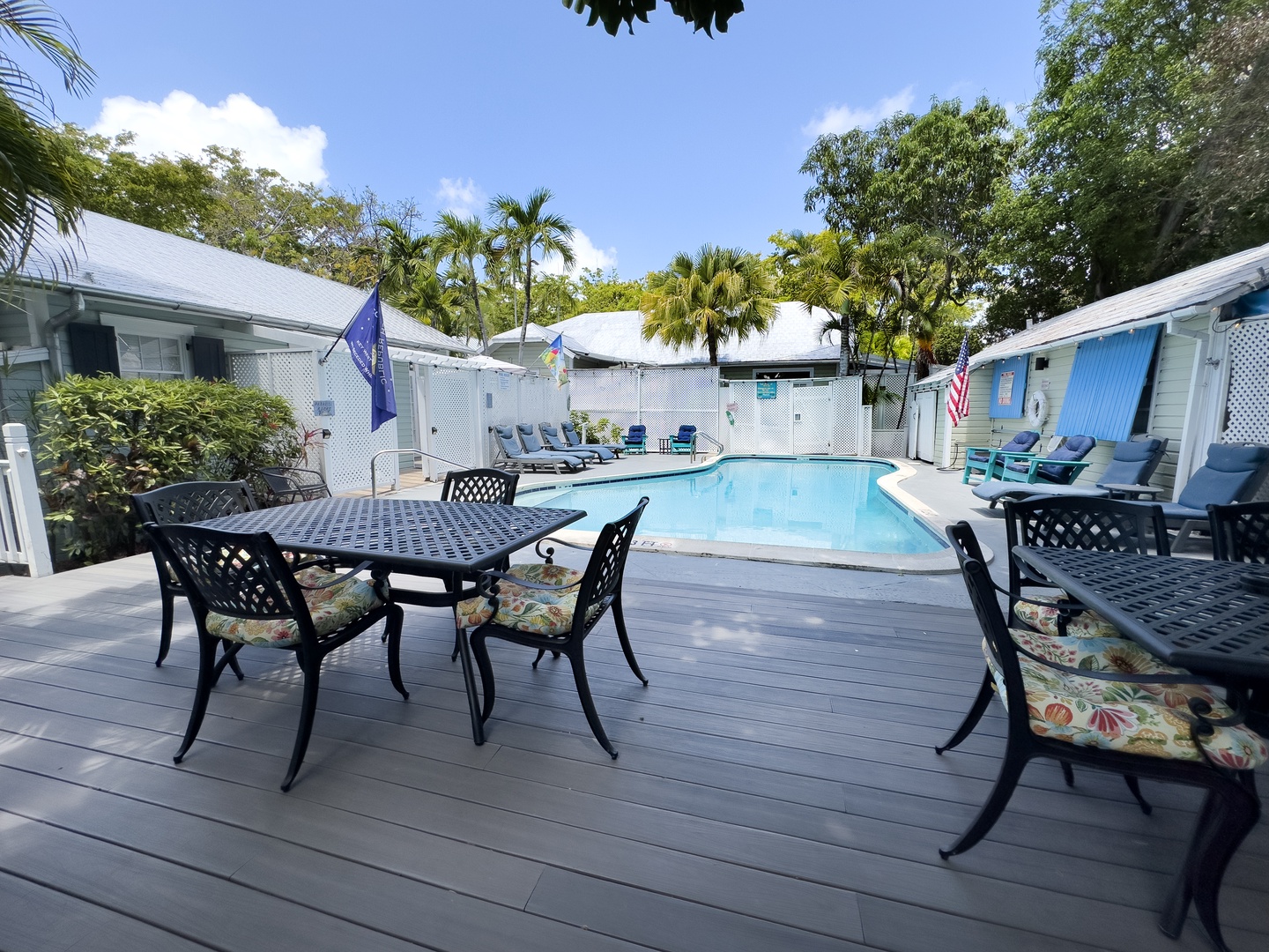 Shared deck with seating area next to pool