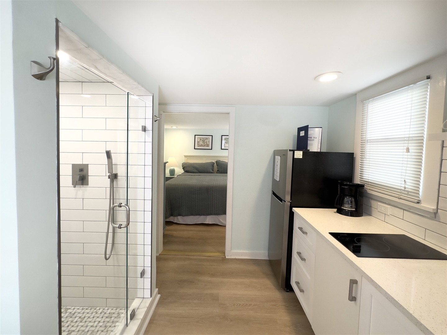 View into kitchen and shower area