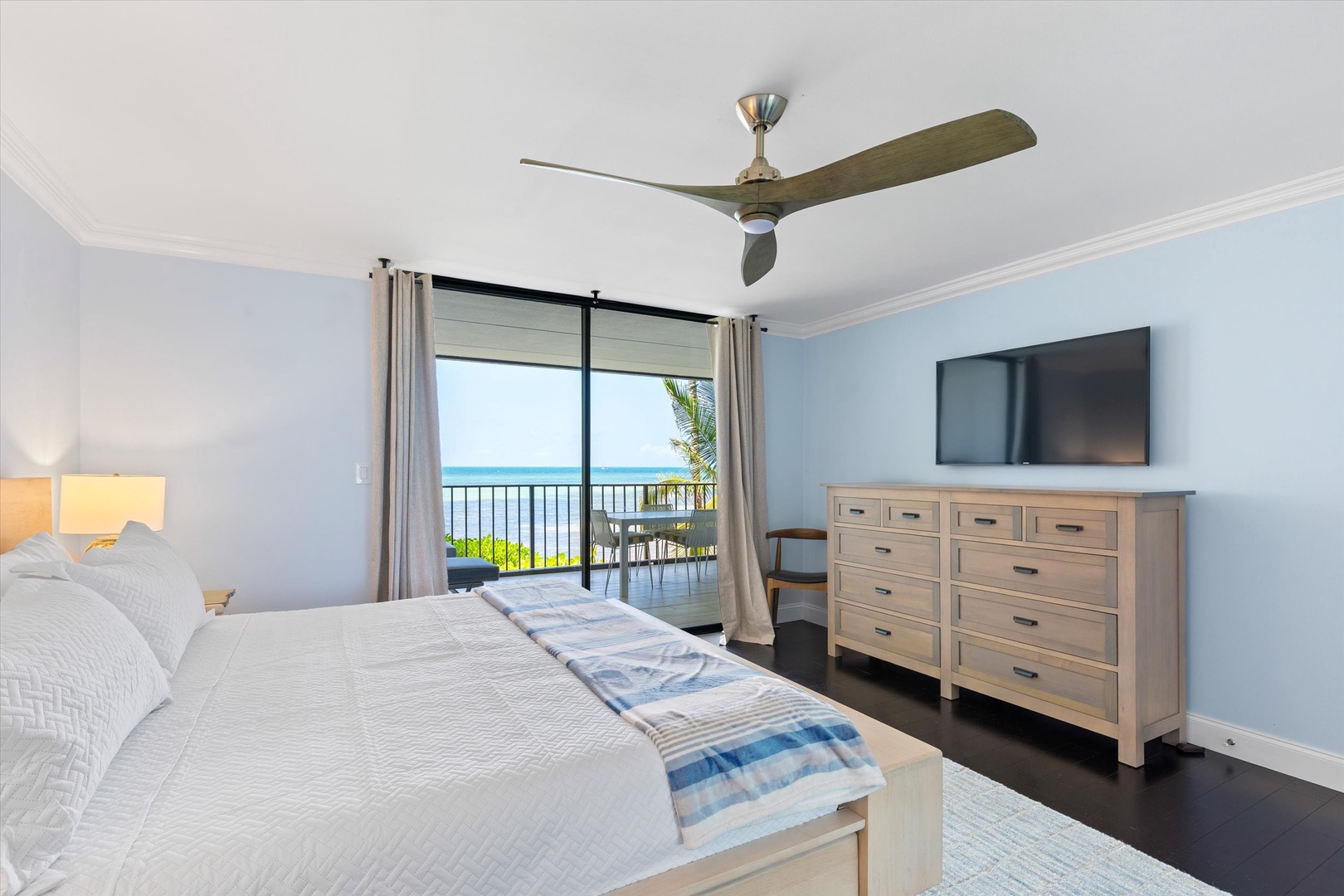Primary bedroom with walk out balcony and seating