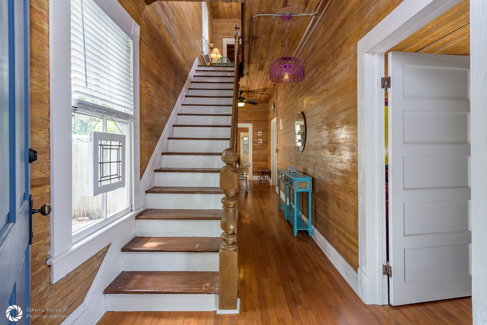 View from front door, hallway to 1st bedroom and kitchen