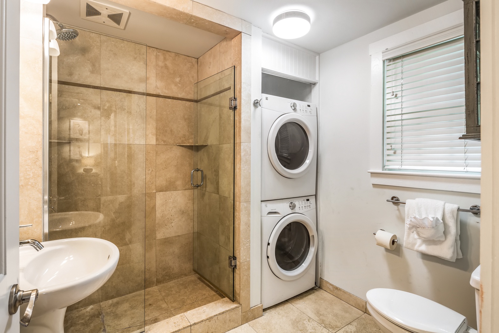 Bathroom with washer and dryer