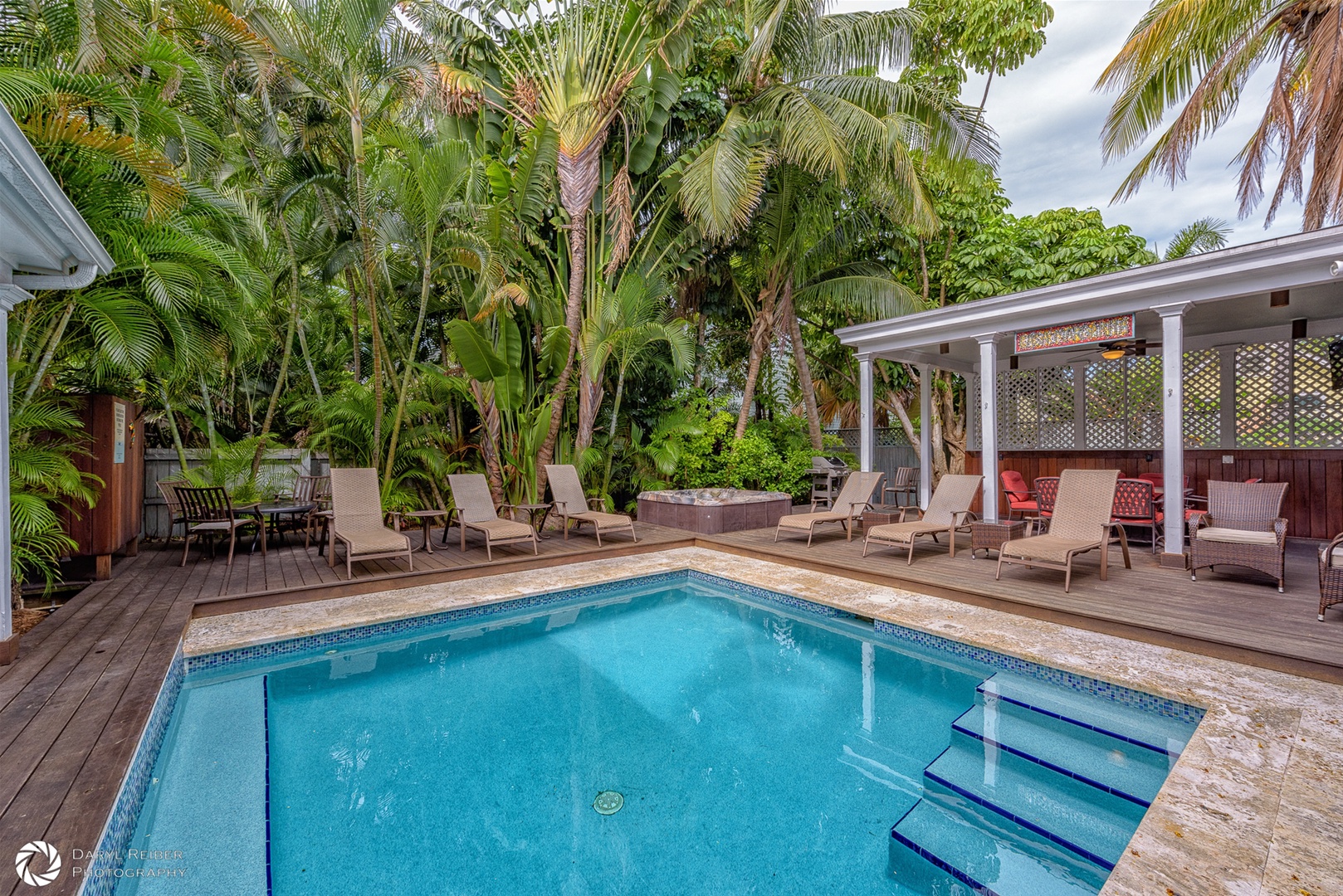 Private Pool and Hot tub with lounge chairs and covered seating area