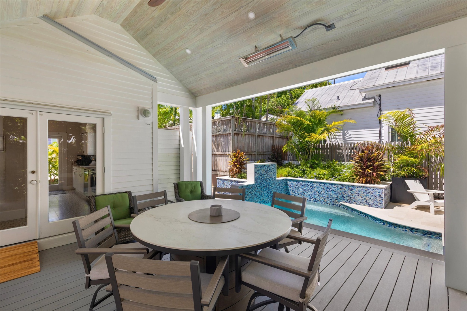 Gather around your private covered patio for alfresco dining beside your sparkling pool, surrounded by tropical greenery and sunshine.